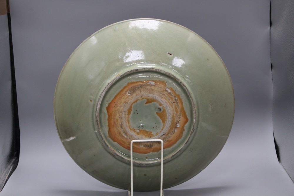 A 15th / 16th century Longquan celadon dish, incised with flowers, diameter 43cm, height 8.5cm